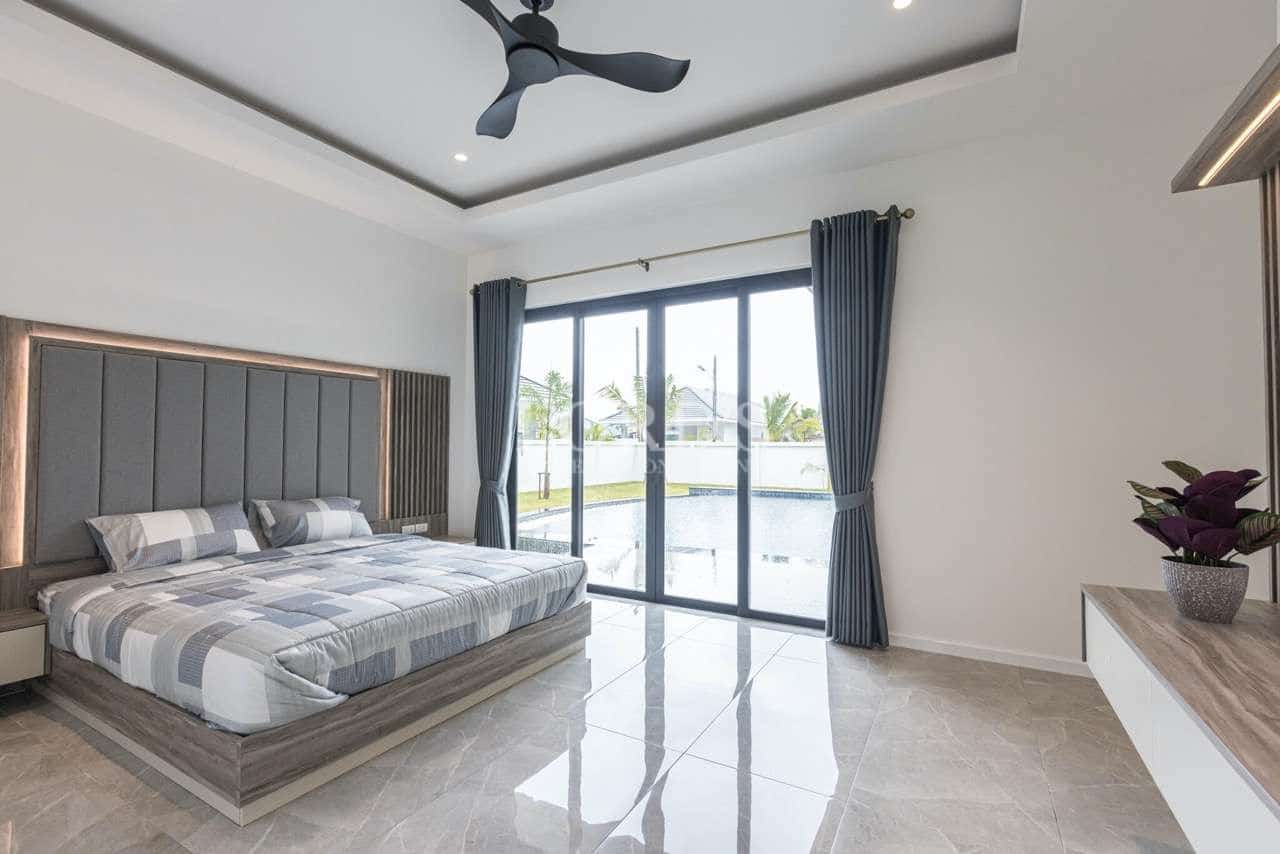 Modern bedroom with large windows