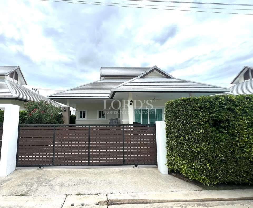 House with gate and greenery