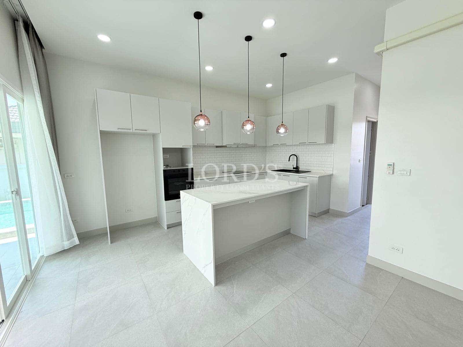 Modern kitchen with island and lights