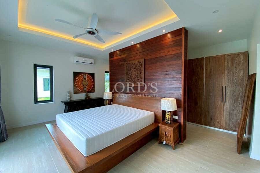 Modern bedroom with wooden accents