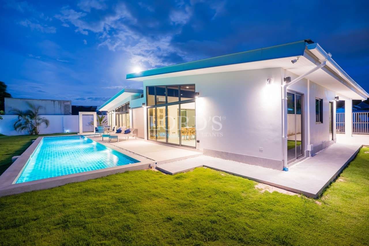 Modern house with pool at dusk